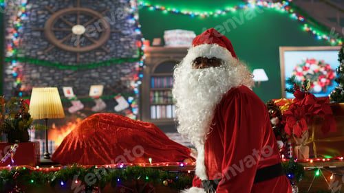 Preview: African american saint Nick preparing his bag full of gifts in wrapping paper