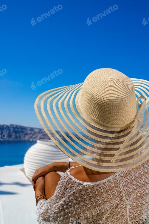 Preview: Woman on holidays in Santorini island