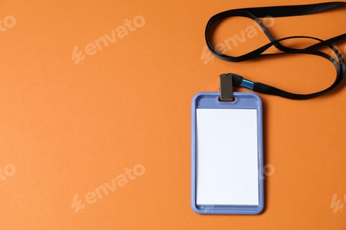 Preview: Blank badge with string on orange background, top view. Space for text