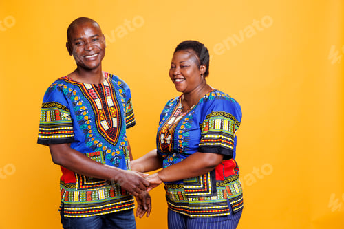 Preview: Happy couple holding hands and posing