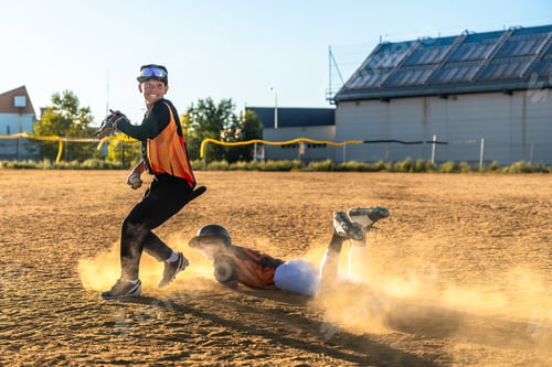 Preview: Baseball player sliding into base during game