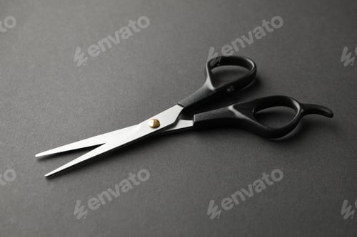 Preview: Black hairdresser scissors on black background, space for text