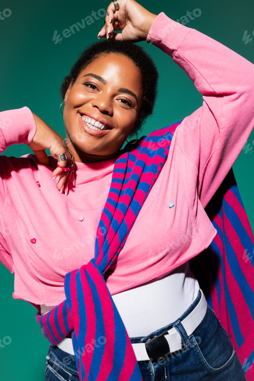 Preview: Stylish plus size woman showcases autumn fashion trends in studio setting