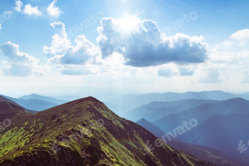 Preview: Summer mountain landscape with rolling green hills