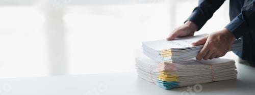 Preview: Businessman sorting stacks of department meeting papers, document management in corporate office. Of