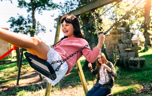 Preview: Three happy girls on a playground