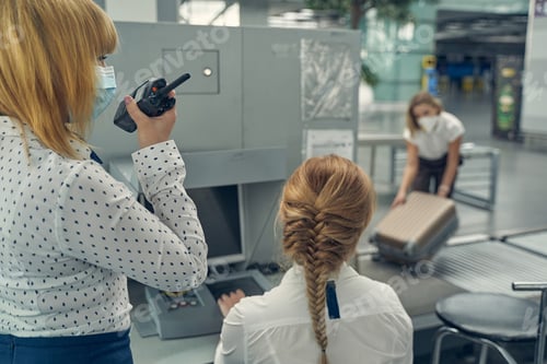 Preview: Young female person working with radio set