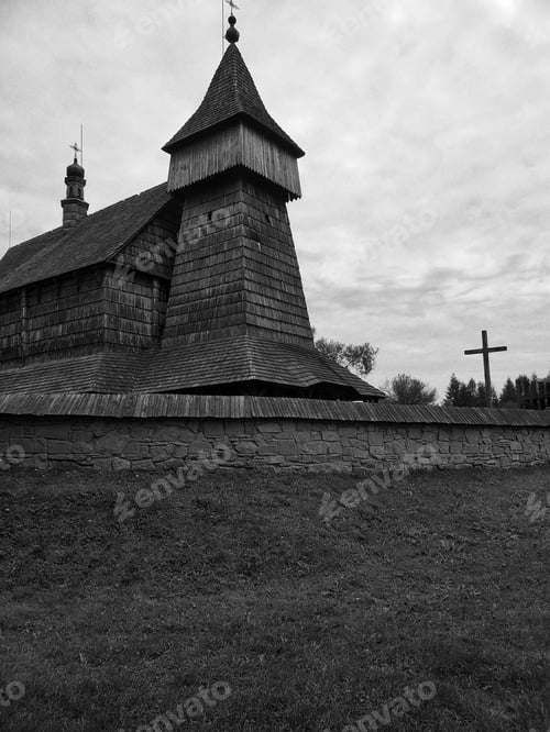 Preview: Grayscale shot of an aged wooden church in Old Village, Poland
