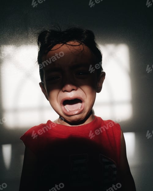 Preview: boy crying between light and shadows