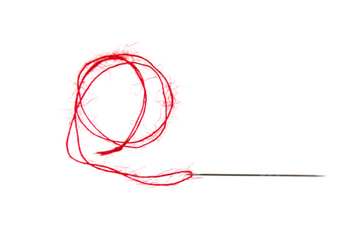 Preview: Threads on a white background. Selective focus.