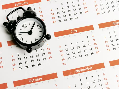 Preview: Time management concept. Alarm clock on calender.