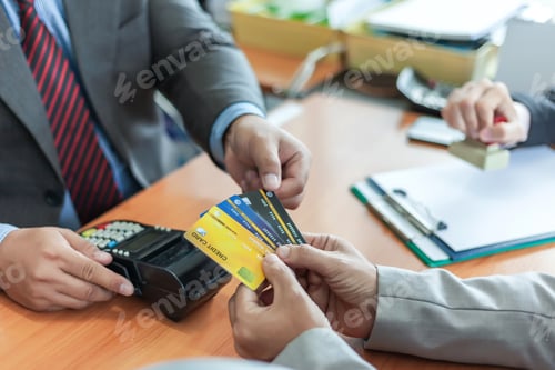 Preview: Groups businessman and credit cards. Credit cards approve. Payment via credit card reader machine.