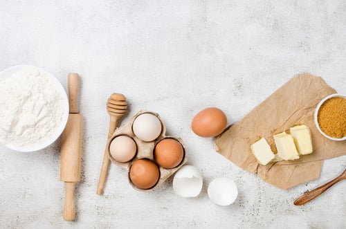 Preview: Ingredients for making dough dishes: cakes, cookies, muffins, pies on a gray background.