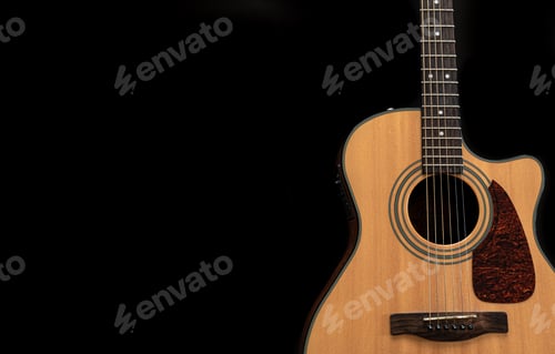 Preview: Acoustic guitar on a black background, flat lay, copy space.