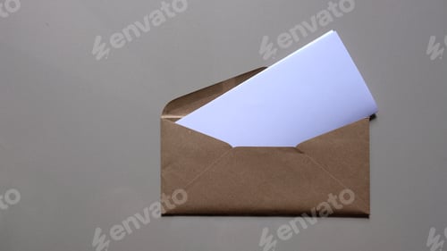 Preview: Brown envelope front with card inside on white background. Letter top view.