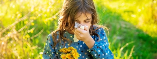 Preview: Child girl allergic to flowers. Selective focus.