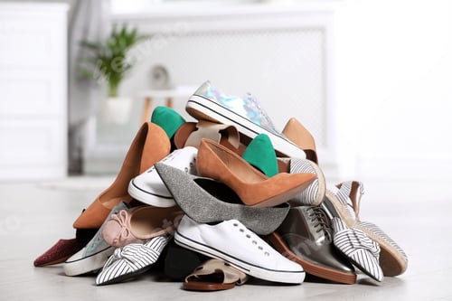 Preview: Pile of female shoes on floor indoors