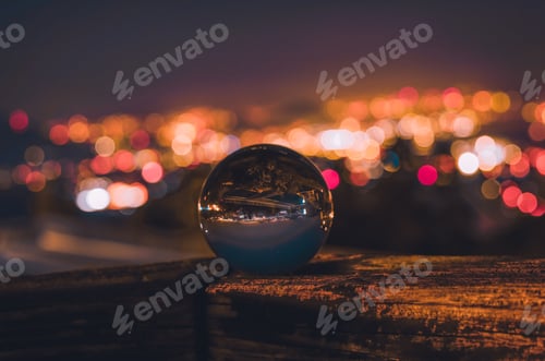 Preview: City Lights Refracted Through Glass Ball at Night