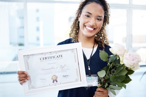 Preview: Certificate, flowers and portrait with a black woman graduate in the hospital, proud of her achieve