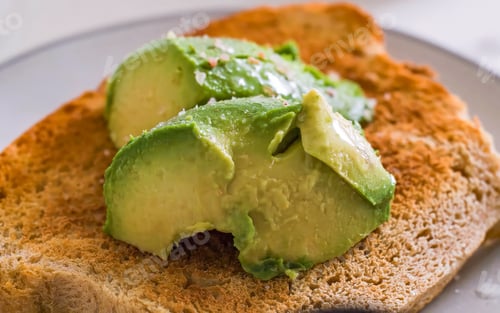 Preview: Avocado Slices Topped with Seasoning on Toast