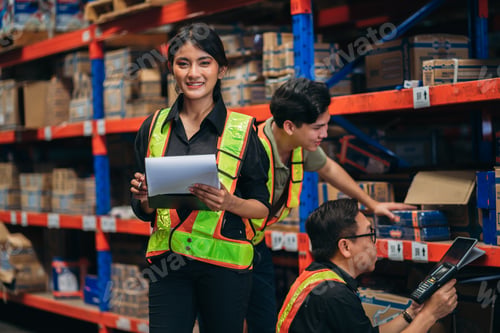 Preview: Warehouse worker working and checking the stock in the warehouse.
