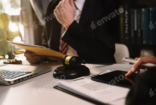 Preview: business people and lawyers discussing contract papers sitting at the table. Concepts of law,