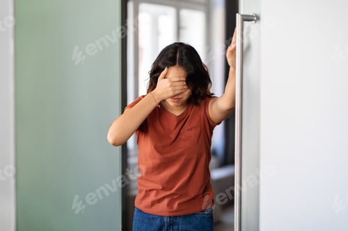 Preview: Dizziness Concept. Dizzy young arab woman suffering vertigo attack at home