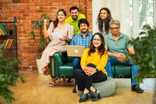 Preview: Young startup team in India celebrating success together in a modern office setting