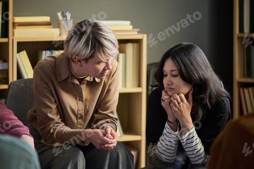 Preview: Adult Woman Supporting Teenager Girl during Group Therapy
