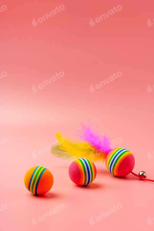 Preview: Pet toys on pink background studio shot