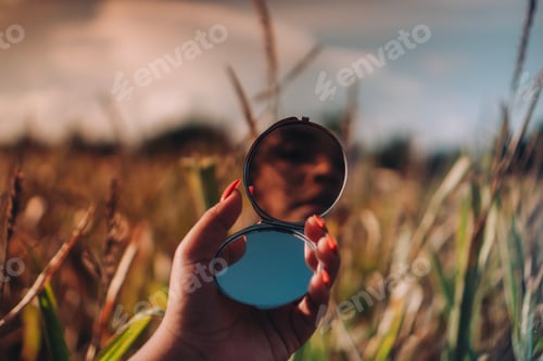 Preview: Reflections - woman looking at herself in the mirror