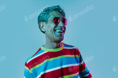 Preview: Senior man posing in studio.
