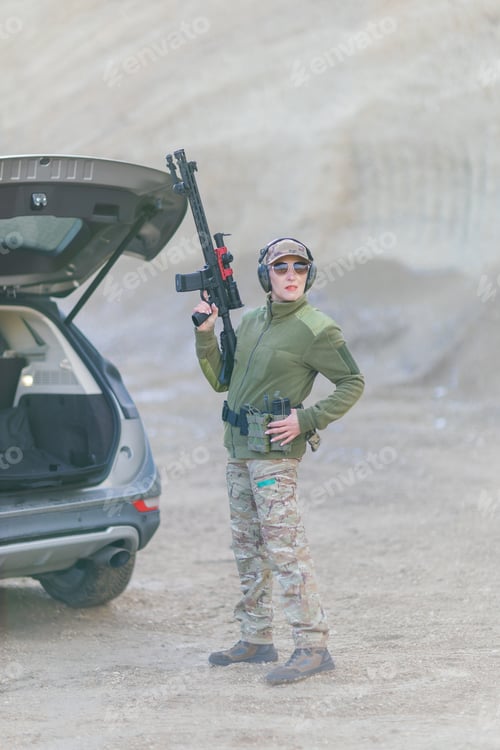 Preview: Soldier holding rifle near vehicle in desert area