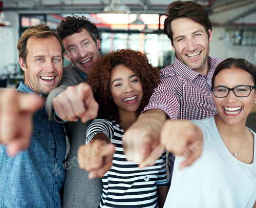 Preview: Youre on the team. Portrait of a group of office colleagues pointing at the camera.