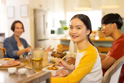 Preview: At home, Eating together, asian family enjoying meal and smiling at dining table