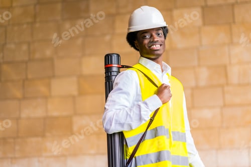 Preview: Portrait of a smiling african architect in a construction site