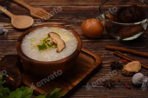 Preview: Delicious traditional Chinese rice porridge with soft boiled egg, shiitake mushroom.