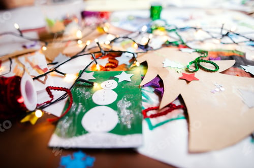 Preview: Children's paintings and Christmas paper art and craft on table