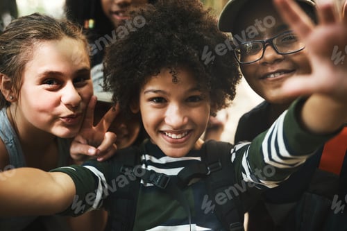 Preview: First selfie of summer camp. Shot of a group of teenagers taking a selfie at summer camp.