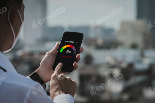 Preview: Man scanning the weather on his phone.Unhealthy weather.pm2.5,City air pollution concept.