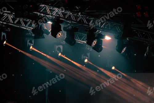 Preview: luminous rays from concert lighting against a dark background, musical instrument concept
