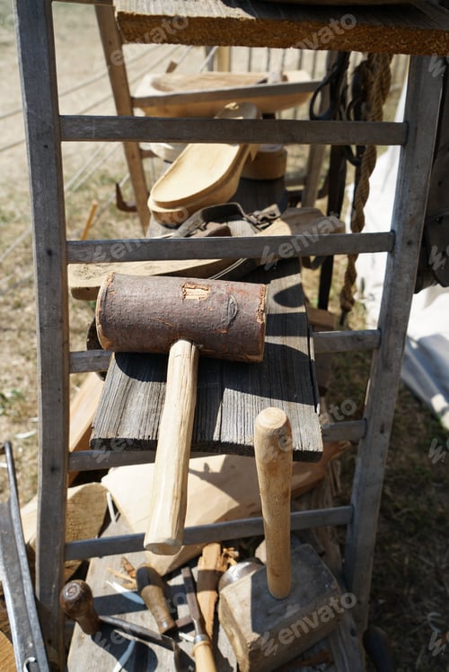 Preview: Vertical shot of wooden hammers and industrial tools