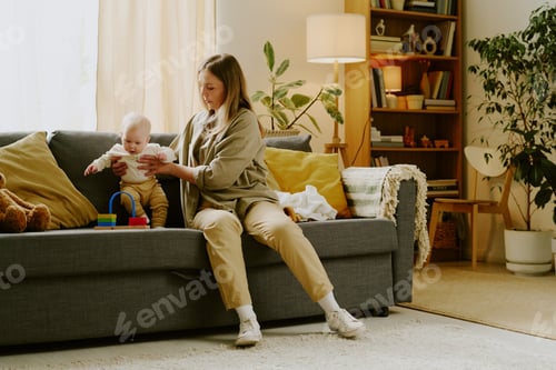 Preview: Caring for Baby in Cozy Living Room with Natural Light
