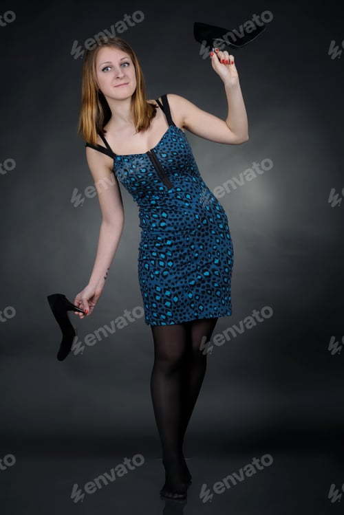 Preview: Girl In Blue Dress On Dark Background