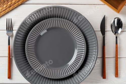 Preview: Glossy grey ceramic plate with cutlery on wooden table