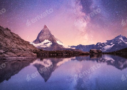 Preview: Matterhorn and reflection on the water surface at the night time. Milky way above Matterhorn mount
