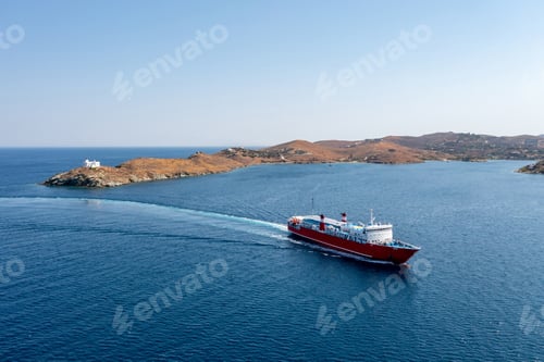Preview: Kea, Tzia island, Cyclades, Greece. Aerial drone view of a ferry approaching Korissia port.