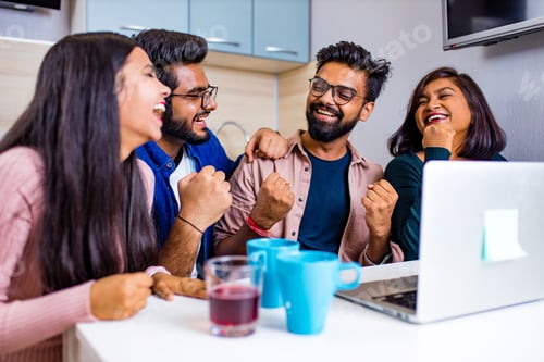 Preview: indian four people in kitchen looking at laptop and discussing a homework distance learning