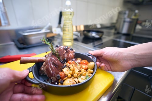 Preview: Cook prepared the meat with vegetables and sauce