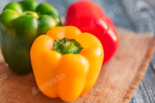 Preview: Variety of bell paprika peppers on cutting board